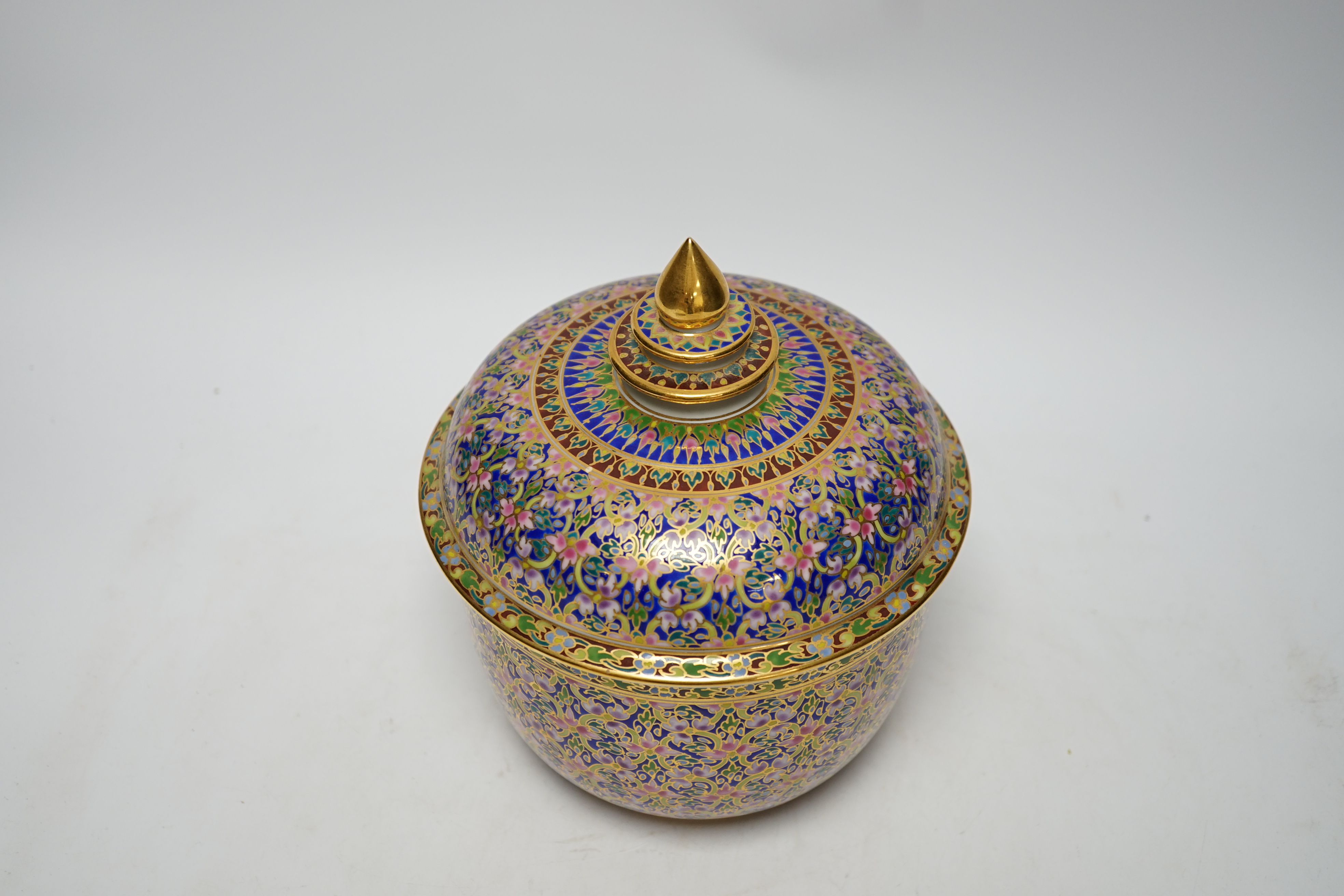 A Continental porcelain bowl and cover enamelled with flowers, 21cm high